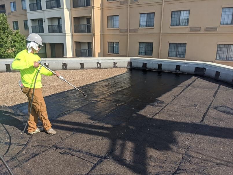 Contractor working on commercial roof